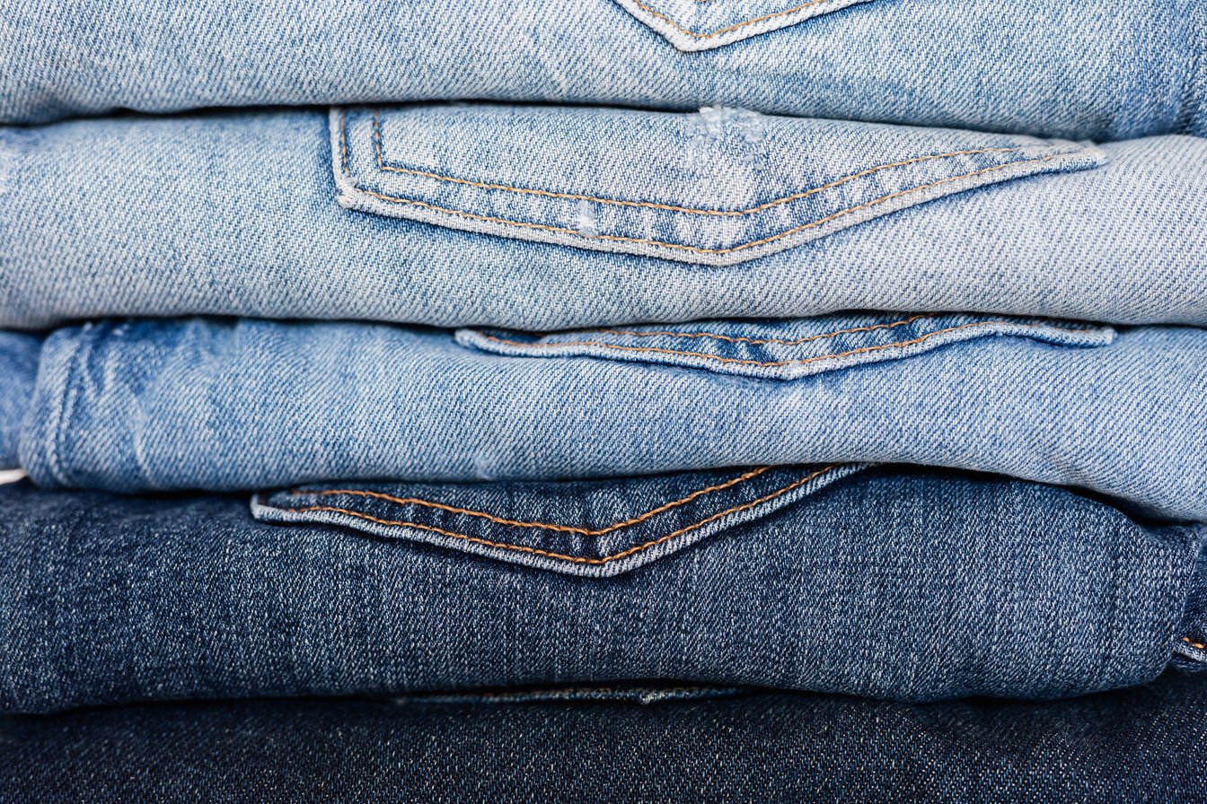 Stack of neatly arranged blue jeans